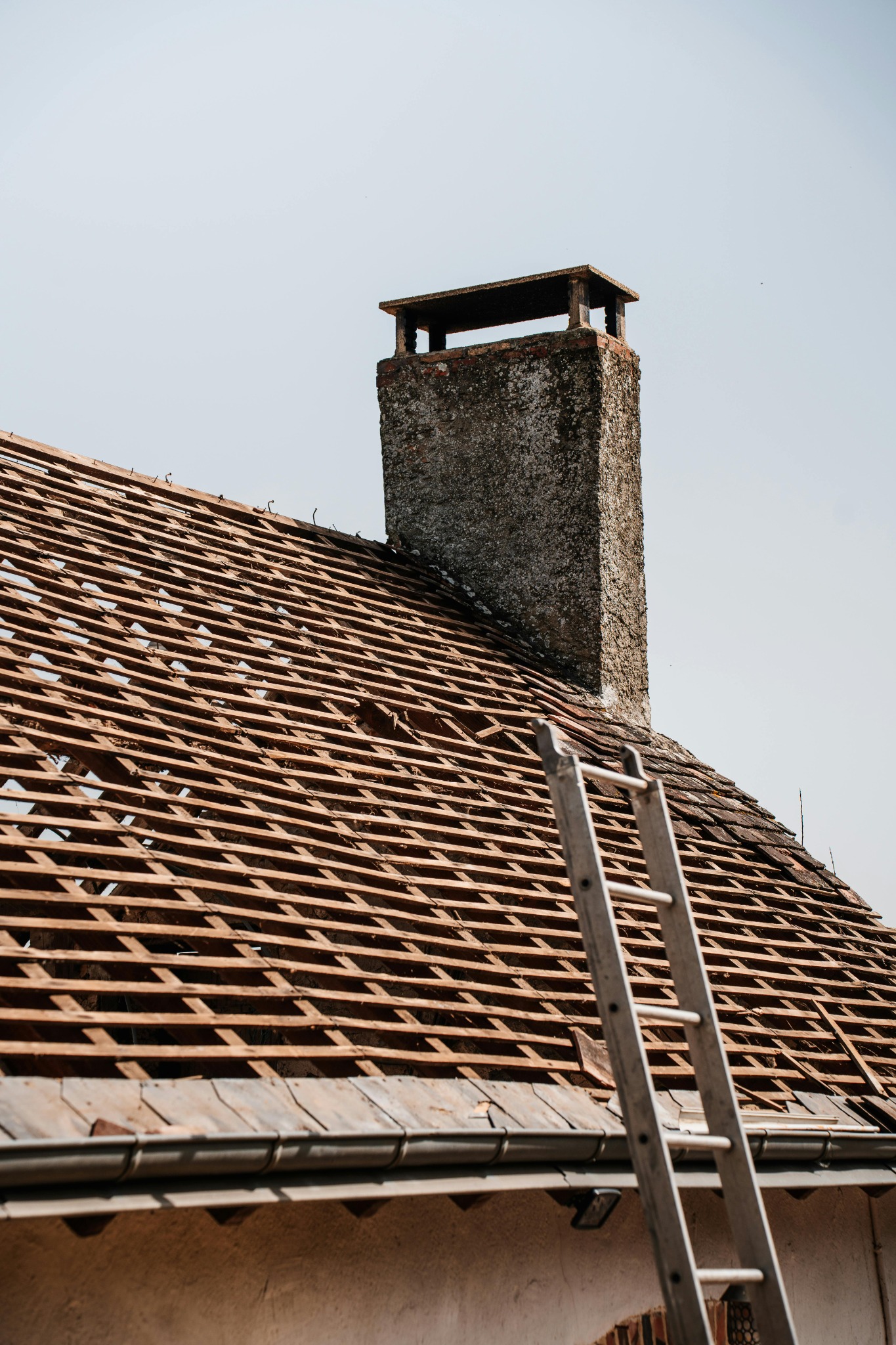 Roof leak repair near chimney flashing